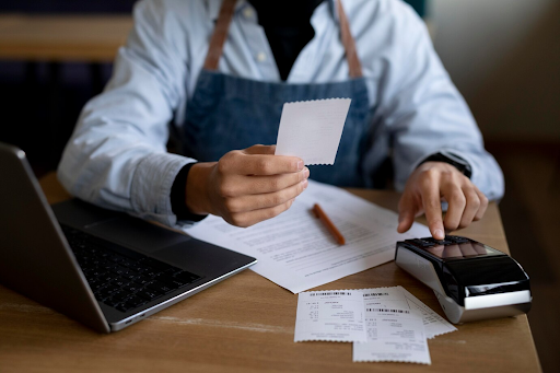 employee checking receipt